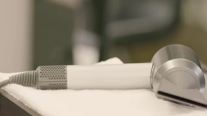 Gently pull open the cage and slide it off the cable.