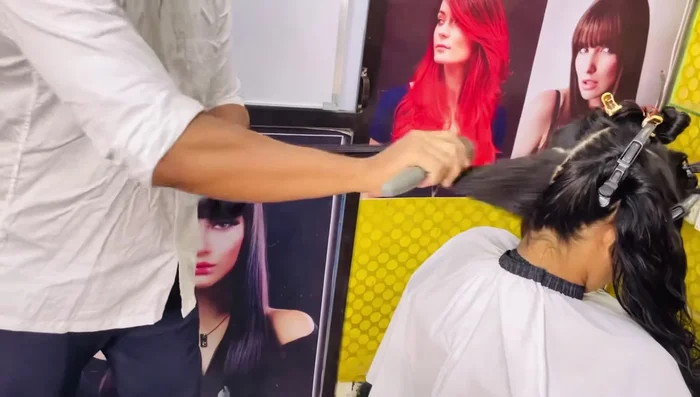 In-and-Out Technique: Use a medium-sized brush for a complete in-and-out blow-dry. This step is crucial for volume and lift at the roots.