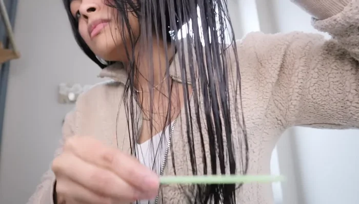 Gently detangle your hair from ends to roots using a wide-tooth comb or wet brush.
