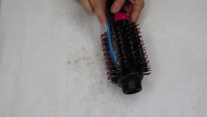 Rinse the brush thoroughly with warm water, keeping it sideways to prevent water from entering the motor.