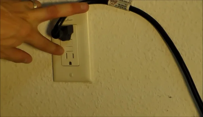 Check for a reset button on the bathroom wall outlet.