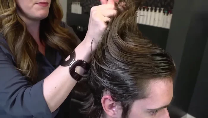 Add more gel if needed, continuing to work the product through your hair with your fingers.