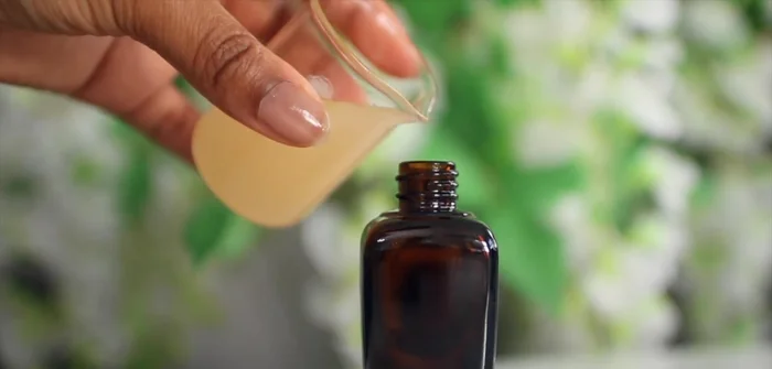 Shake the bottle before applying a tiny amount to the ends of your hair, working upwards and avoiding the scalp.