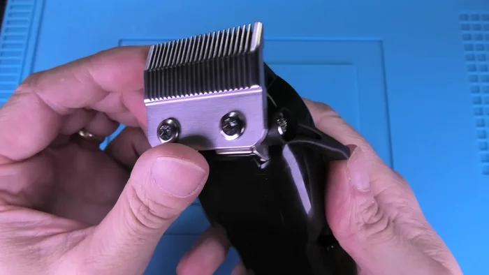 Clean the inside of the clipper using the small brush to remove any trapped hair or dirt.