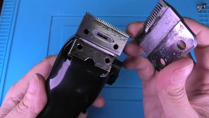 Clean the inside of the clipper using the small brush to remove any trapped hair or dirt.