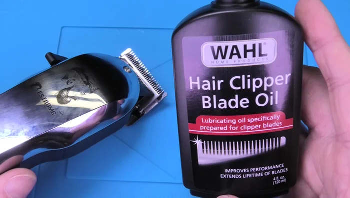 Lubricate the blades with 2-3 drops of clipper oil while the clipper is running to distribute the oil evenly.