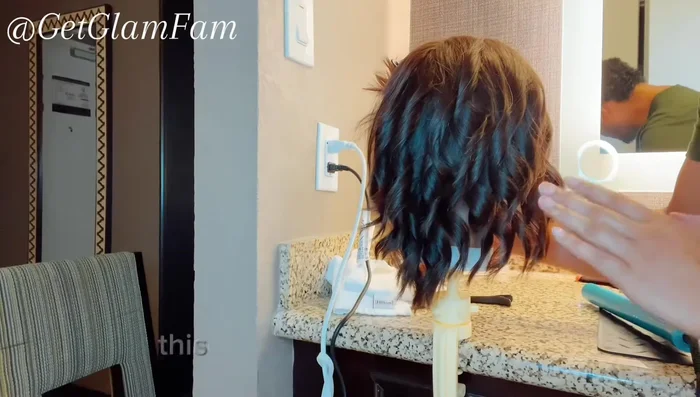 Once all sections are complete, gently run your fingers through your hair to separate the curls and create a tousled, beachy look.