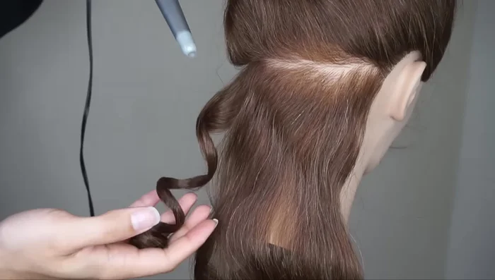 Hold and release: Hold the section for about 10 seconds. Gently release the curl and allow it to cool completely before touching.