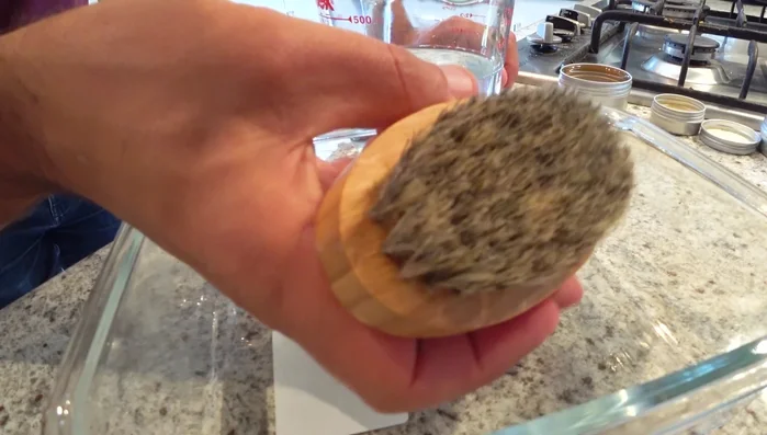 Clean with soap and water: Submerge the brush in warm water with dishwashing liquid, ensuring all bristles are covered. Let it soak for 15-20 minutes.