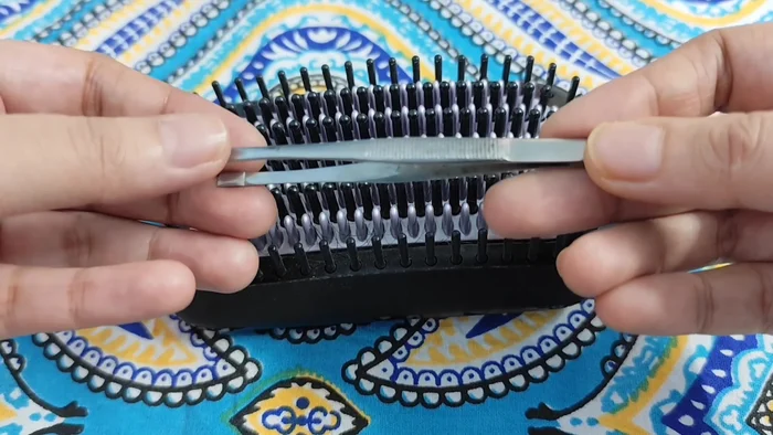 Remove stuck hair strands with your fingers and tweezers.