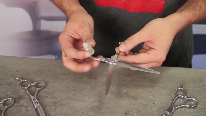 Gently rub the oil into the pivot point and blade area, avoiding the sharp edges of the blades.