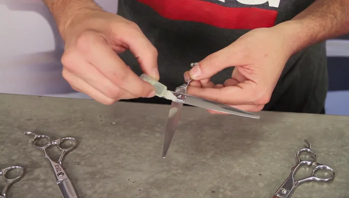 Gently rub the oil into the pivot point and blade area, avoiding the sharp edges of the blades.
