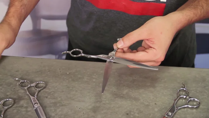 Gently rub the oil into the pivot point and blade area, avoiding the sharp edges of the blades.