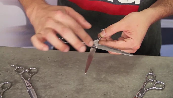 Gently rub the oil into the pivot point and blade area, avoiding the sharp edges of the blades.