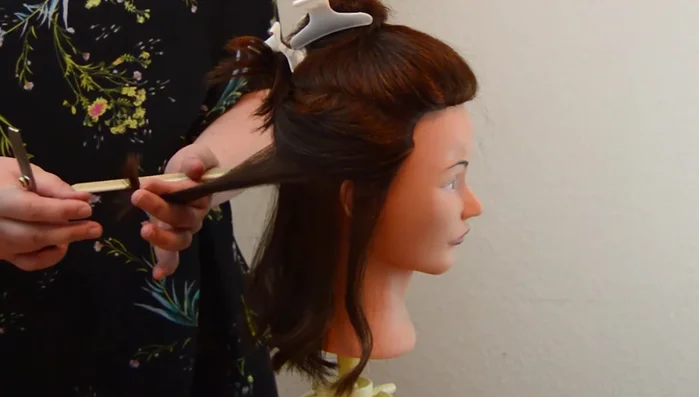 Continue thinning more sections using the same process. Consider that hair around the face is naturally thinner.