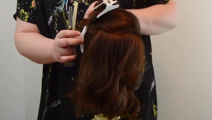 Continue thinning more sections using the same process. Consider that hair around the face is naturally thinner.