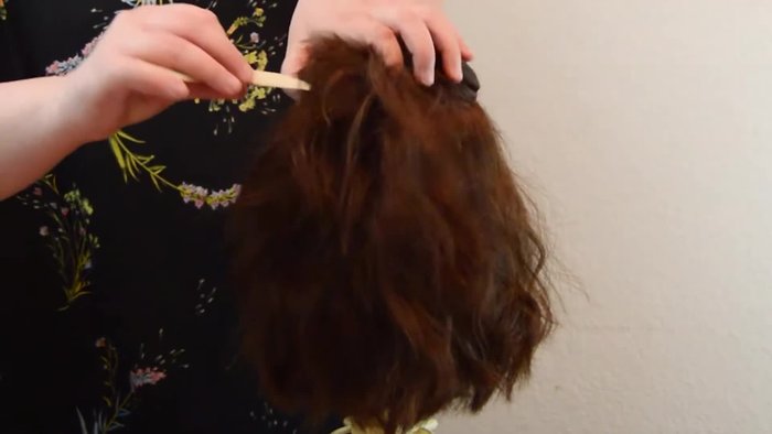 Start with the top section, clipping it out of the way. Create additional sections above the ears and below the top section.