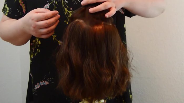 Start with the top section, clipping it out of the way. Create additional sections above the ears and below the top section.