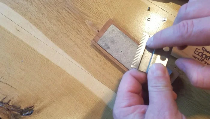 Observe the change in color of the plates; lighter sections indicate sharpened areas.