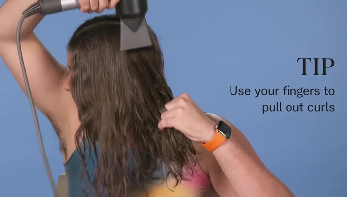 Rough dry the hair using fingers to remove initial curl and to create tension.