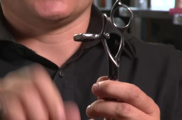 Employ Revo (rotating thumb) scissors. The design minimizes obstruction when cutting against the skin and reduces pressure on the carpal tunnel nerve.