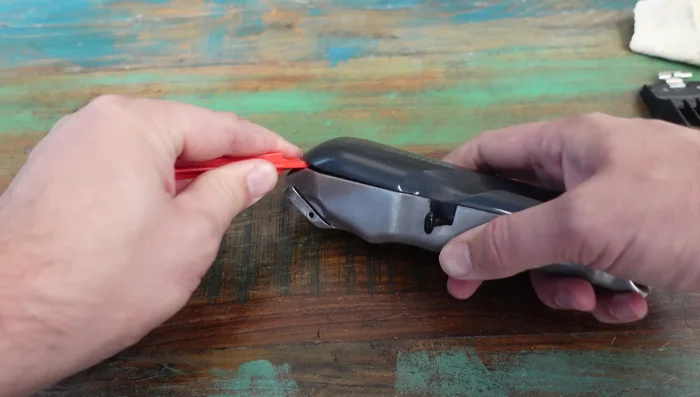 Use a small tool to scrape off remaining gunk around the edges and ensure a clean seal when reassembling.