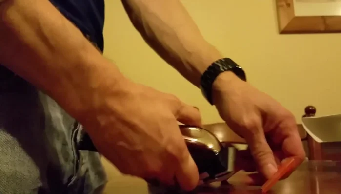 Kemei KM-2600 hair clipper in hand