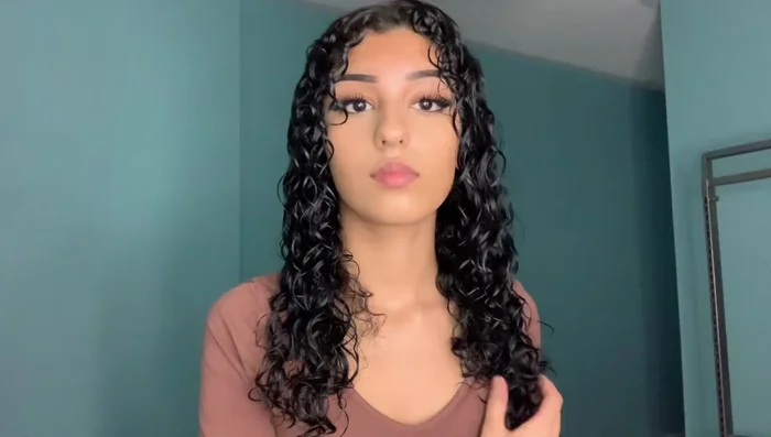 Diffuse the rest of your hair: Gently place sections of your hair under the diffuser, moving slowly to avoid frizz. Lift strands to reach the inner layers.