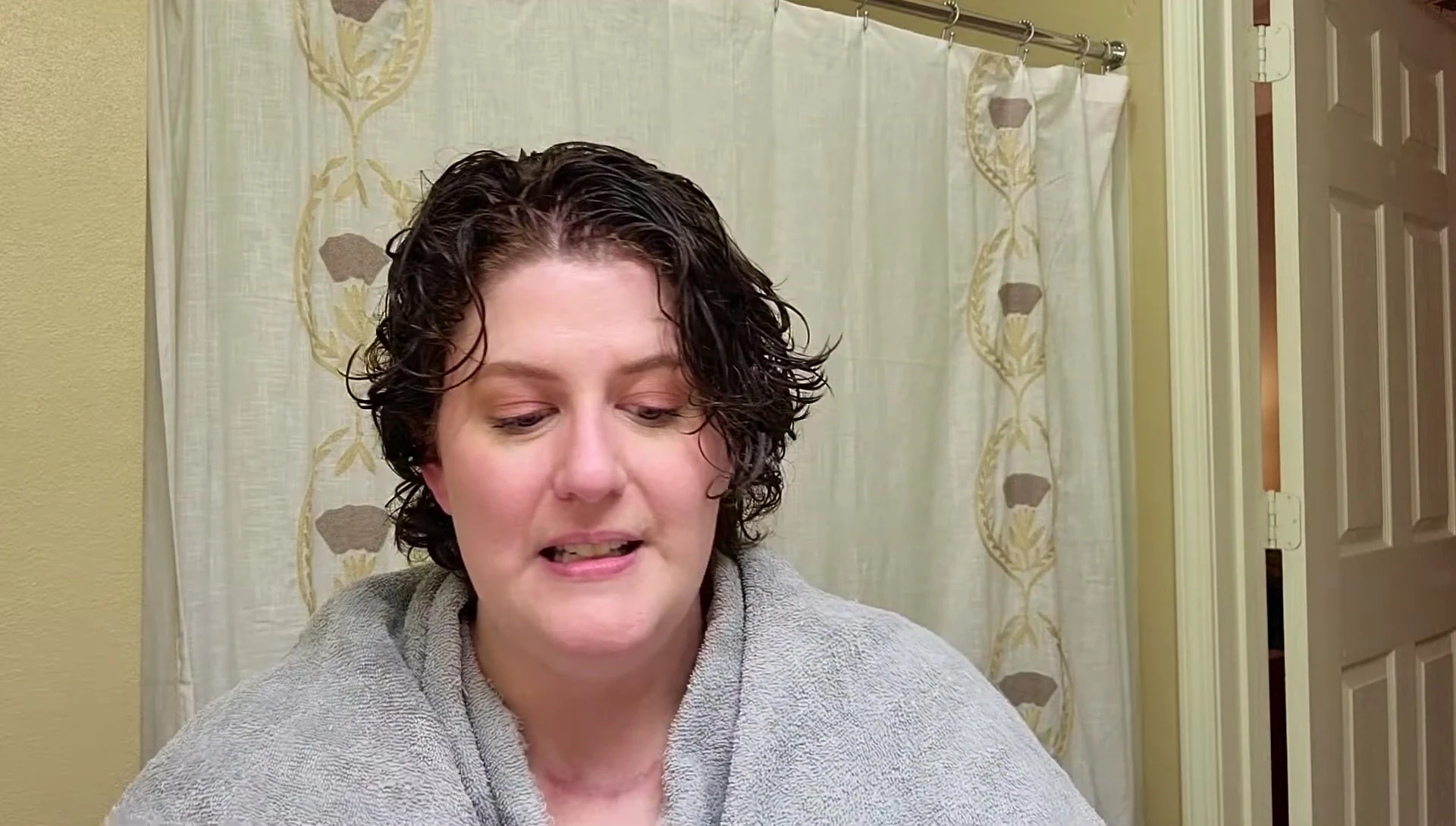 Woman applying hair dye at home