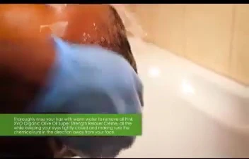 Person rinsing the texturizer from their hair.
