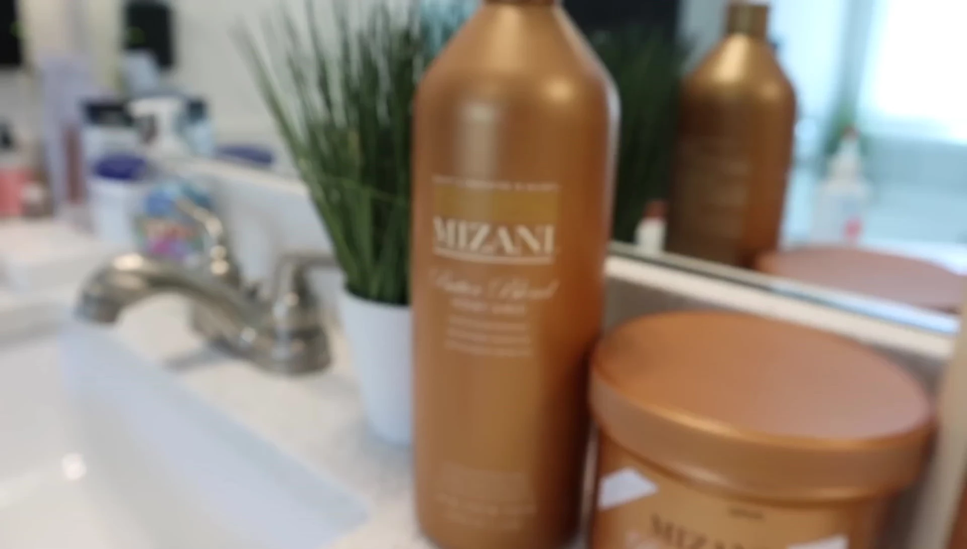 The vlogger shows her Mizani Butter Blend products.