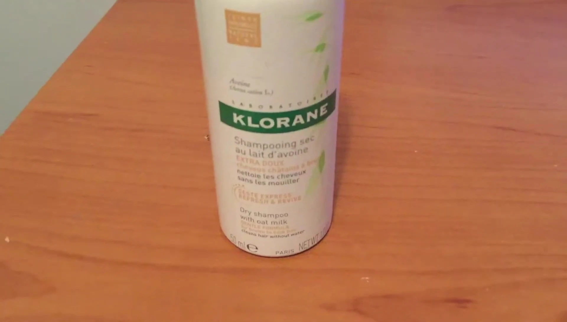 Close-up of the Klorane Oat Milk Dry Shampoo travel-size bottle.