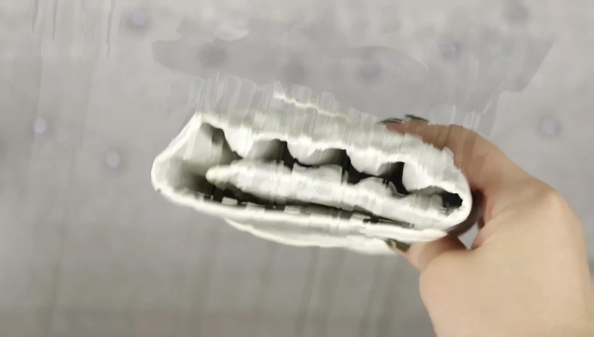 The brush roll closed, showcasing its compact and portable design.