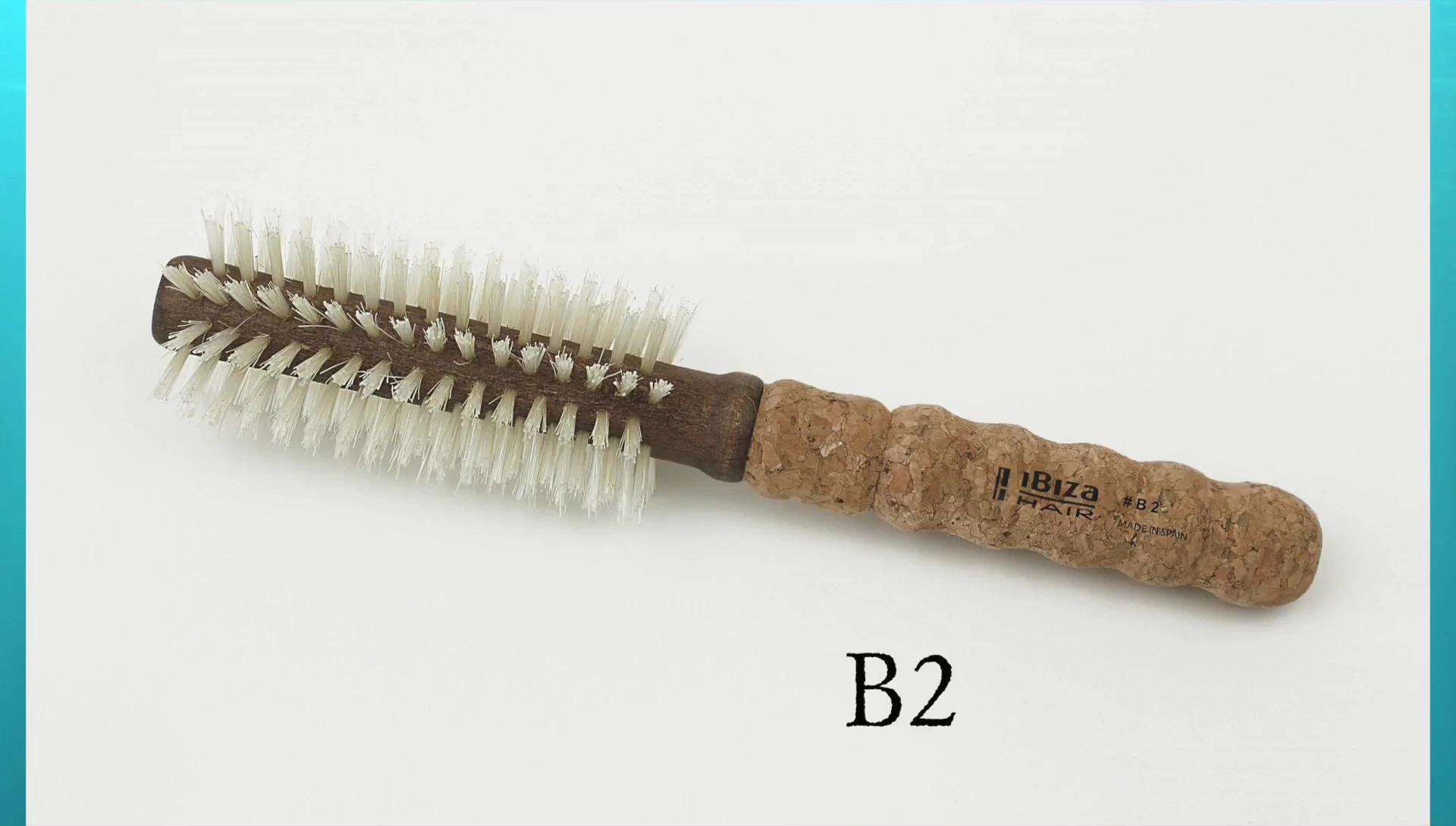 Stylist using a B series brush on blonde hair.