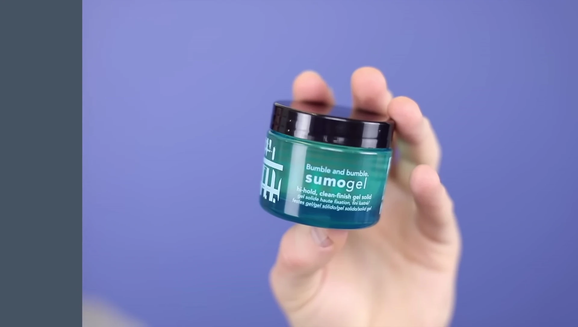 The presenter showcasing a jar of gel.