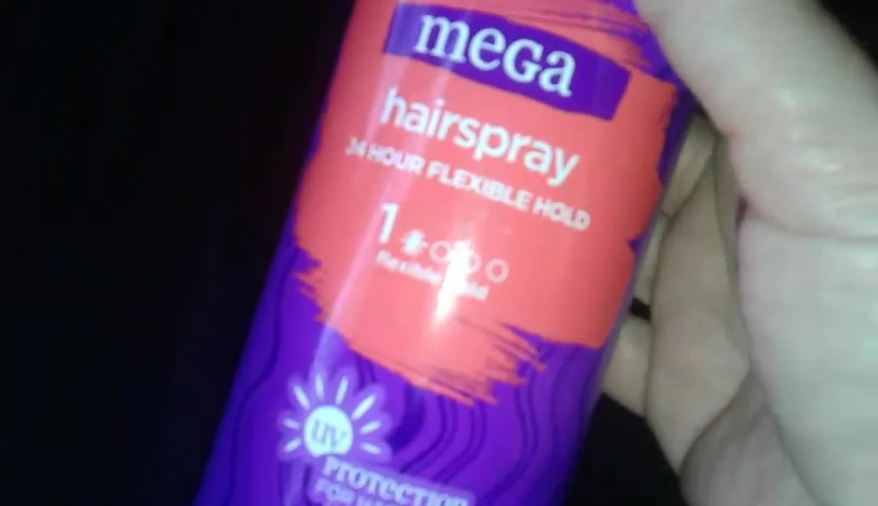 The reviewer highlighting the UV protection aspect of the hairspray.