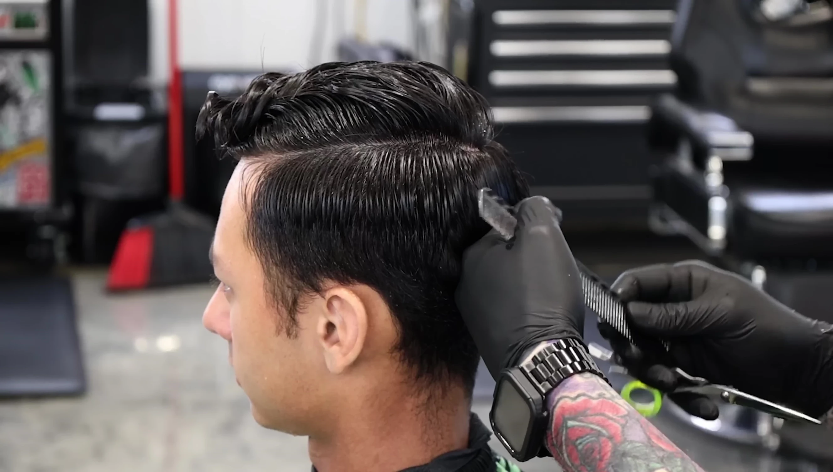 Stylist demonstrating the connection between scissor and clipper work
