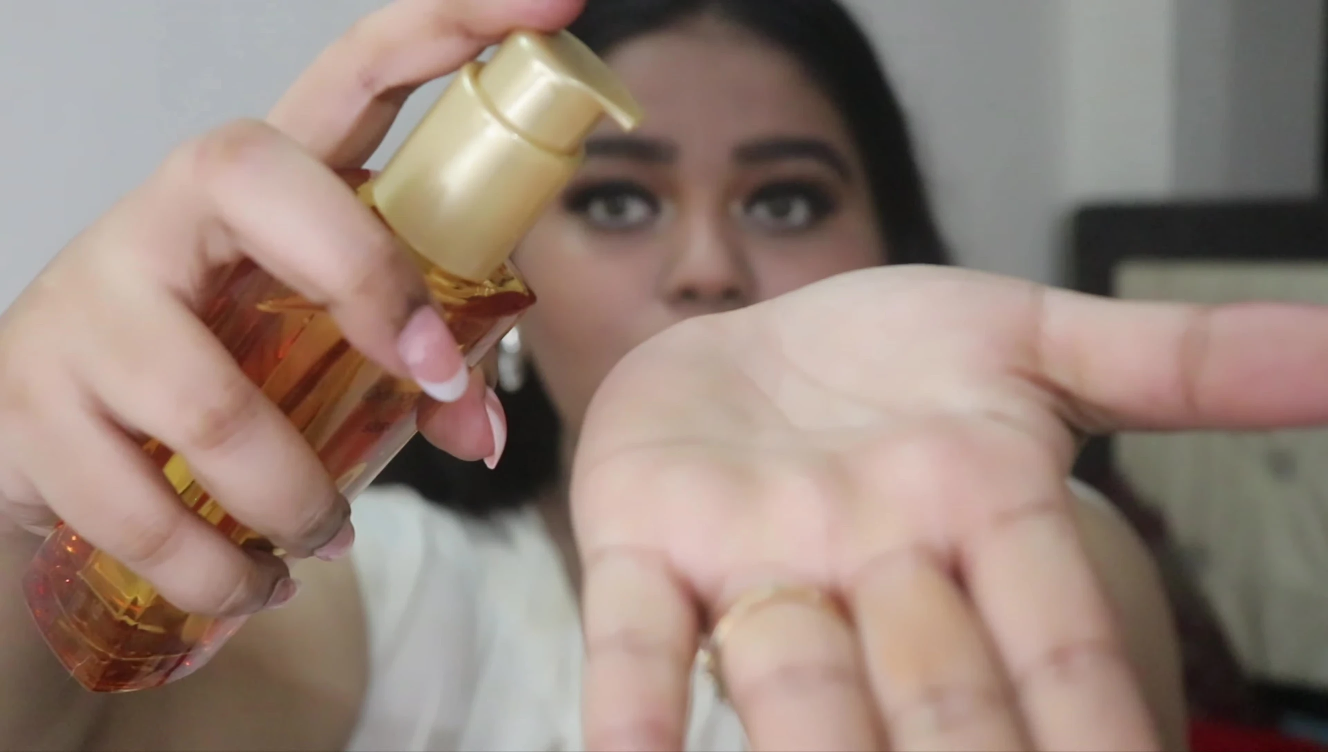 Close-up showing the texture of the serum after dispensing one pump.