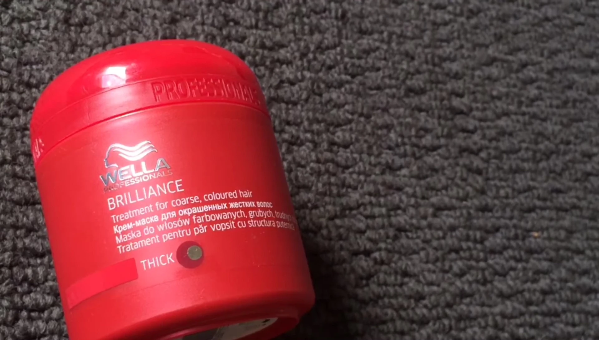 Close-up of the Wella Professionals Brilliance Hair Mask tube.