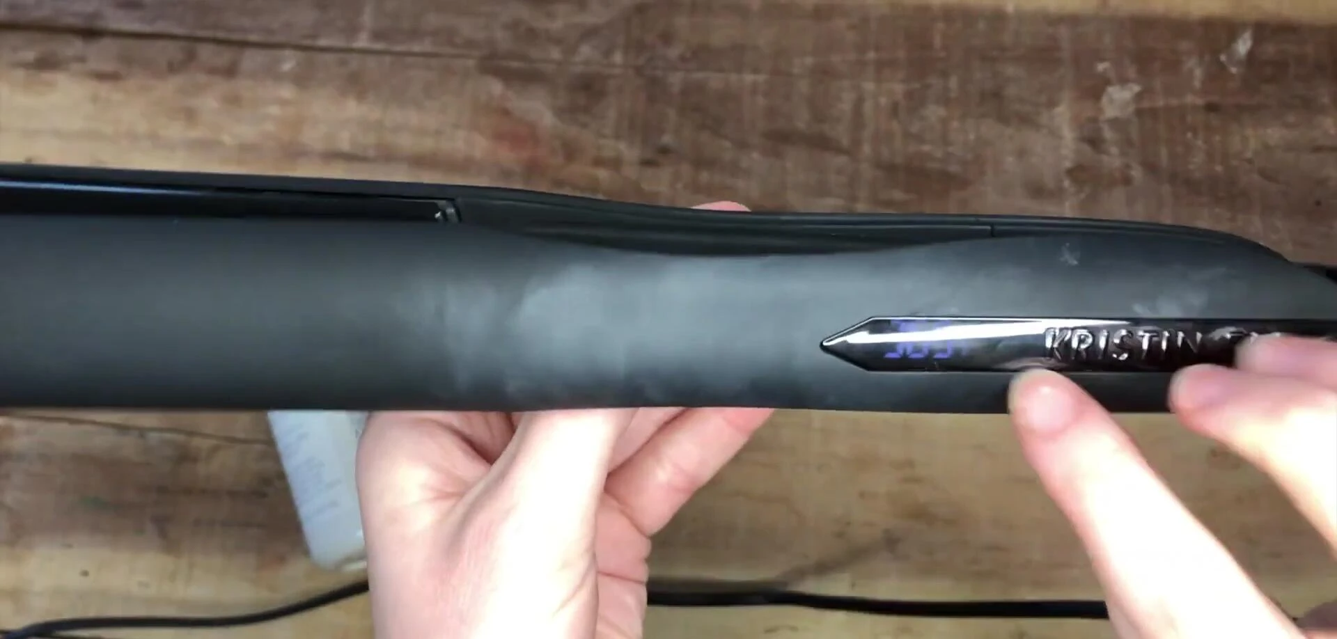 The flat iron displaying its temperature settings