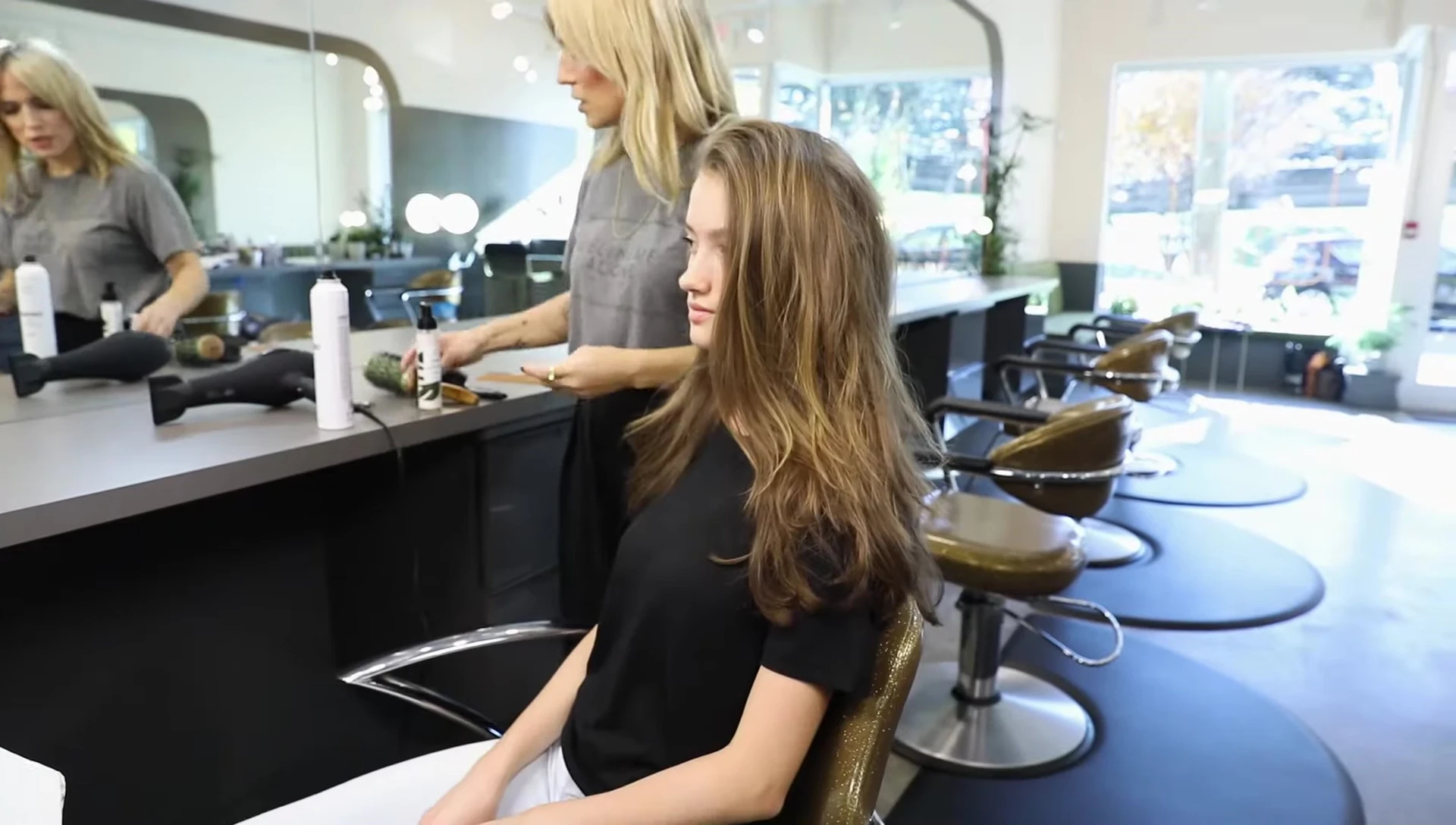 Applying hair oil for shine and frizz control