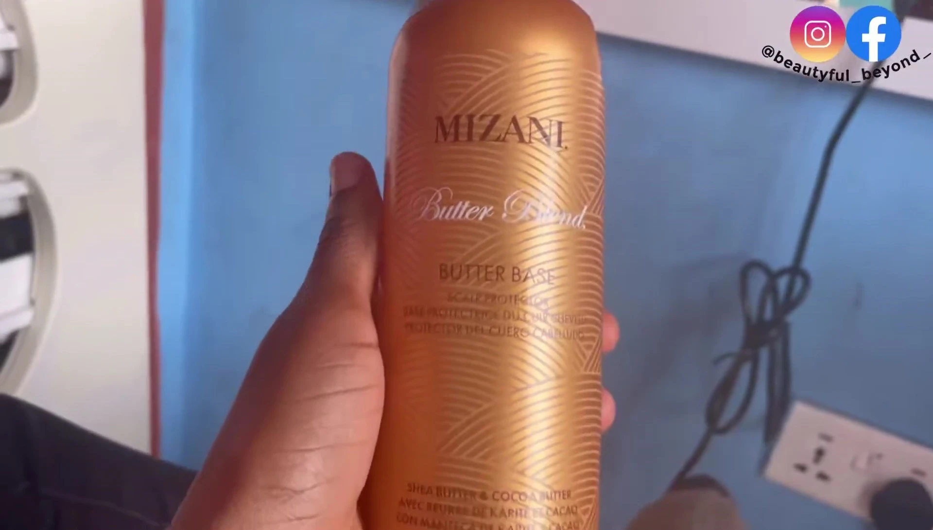 The stylist preparing the Mizani relaxer and scalp protectant.