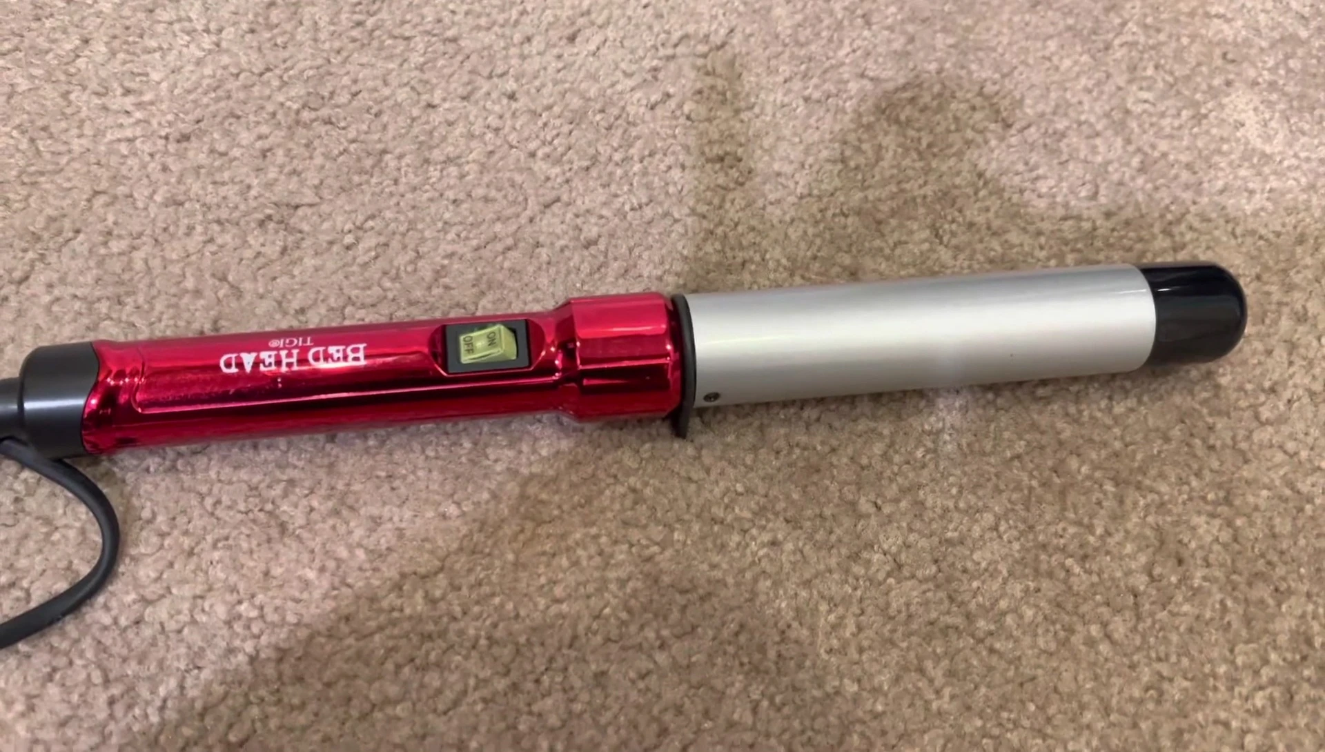 The reviewer highlighting the positive aspects of the curling wand.