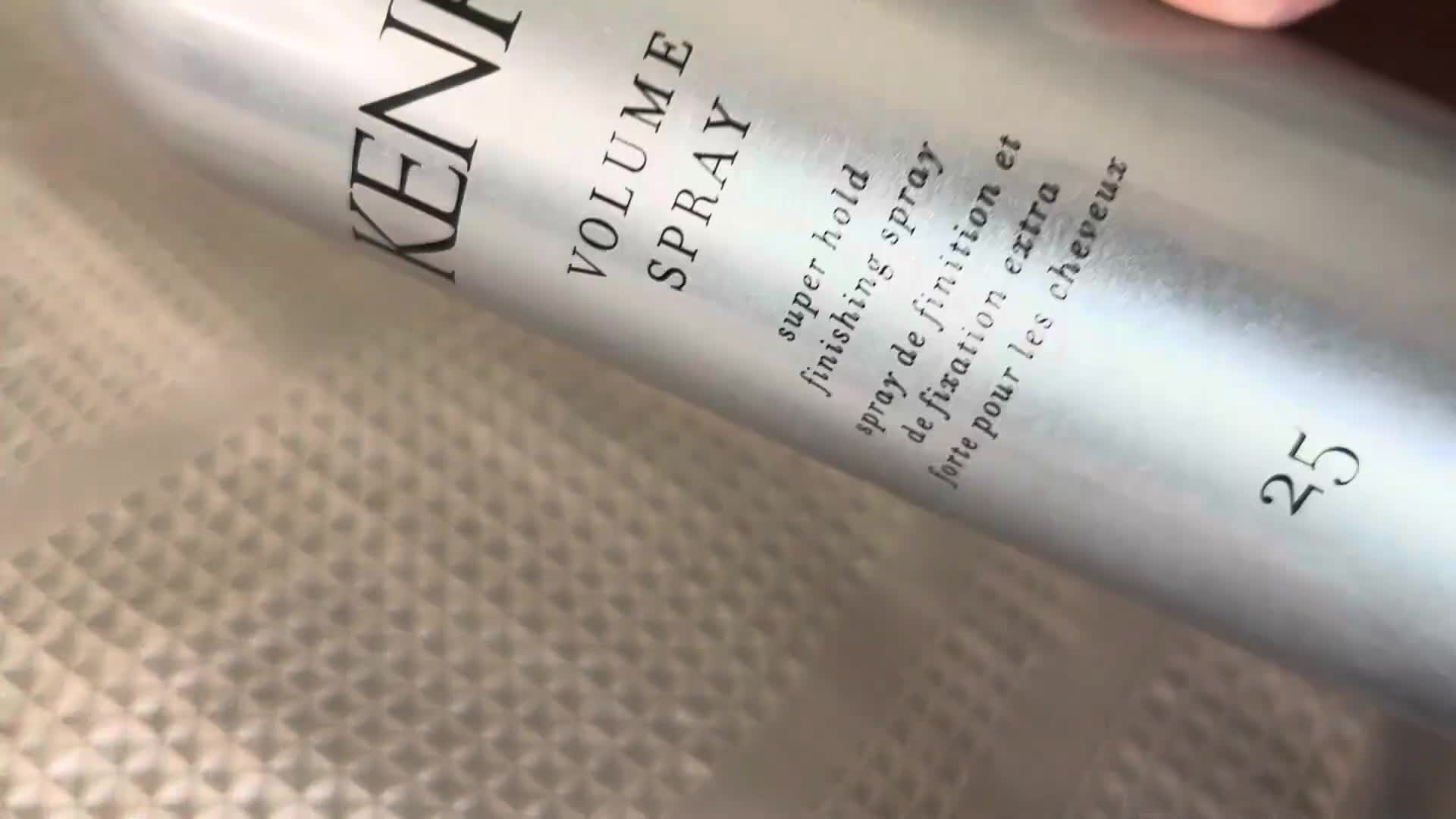 Close-up shot highlighting the sleekness and hold provided by the hairspray.