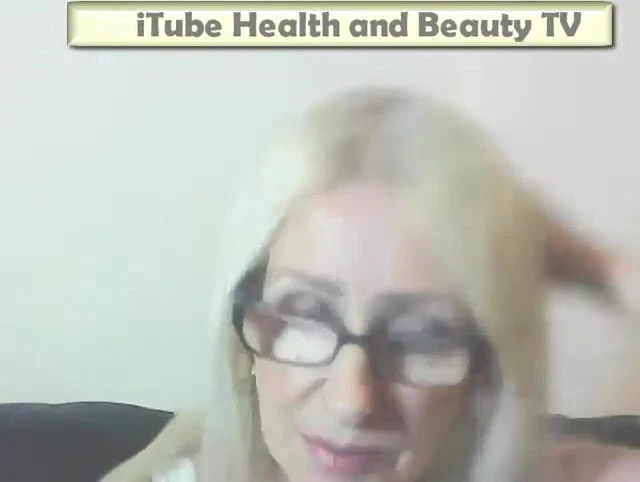 Image of the user blow-drying their hair upside down.