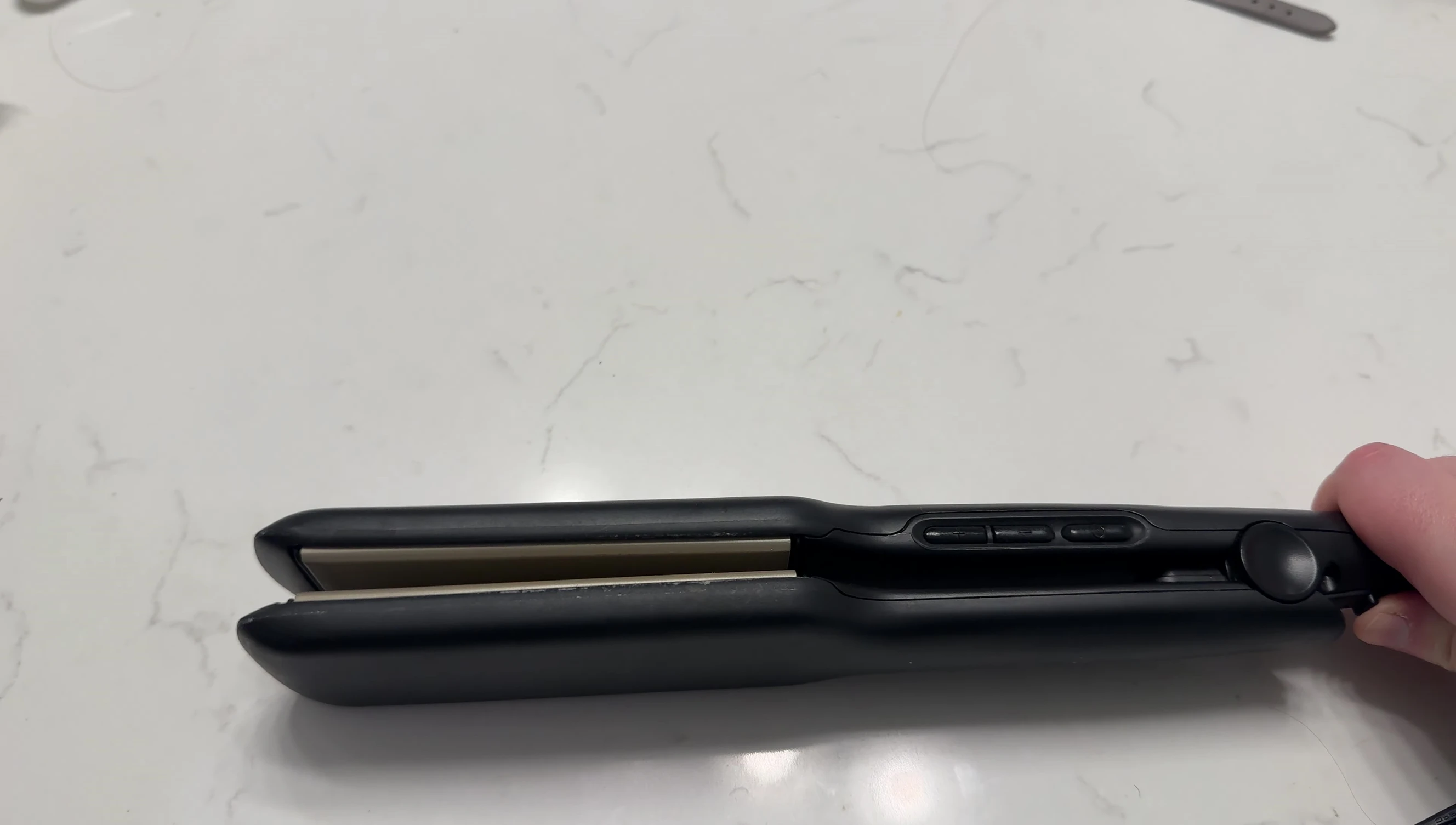 Close-up shot of the locking mechanism on the straightener.