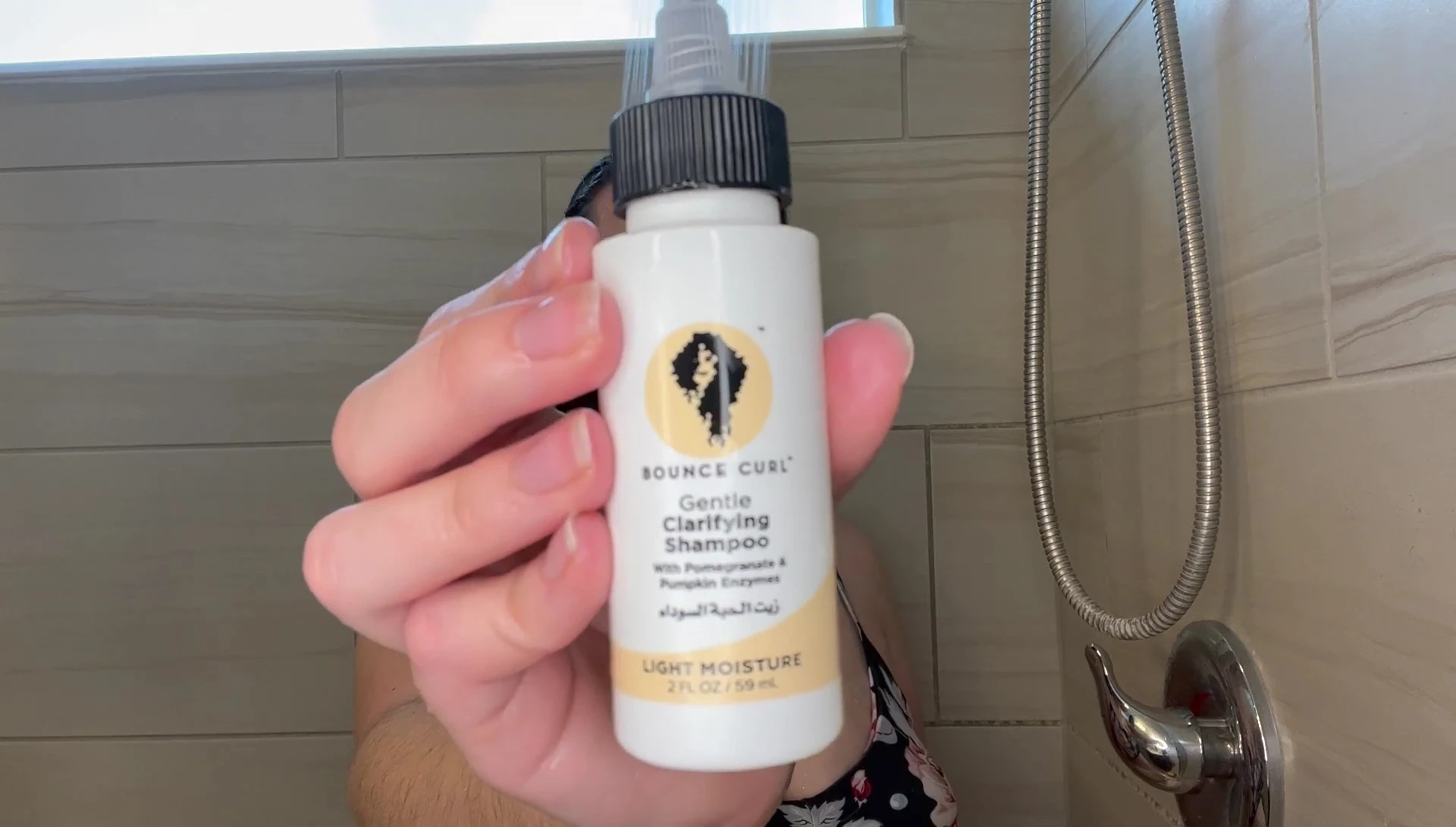 Close-up of the Bounce Curl Gentle Clarifying Shampoo bottle