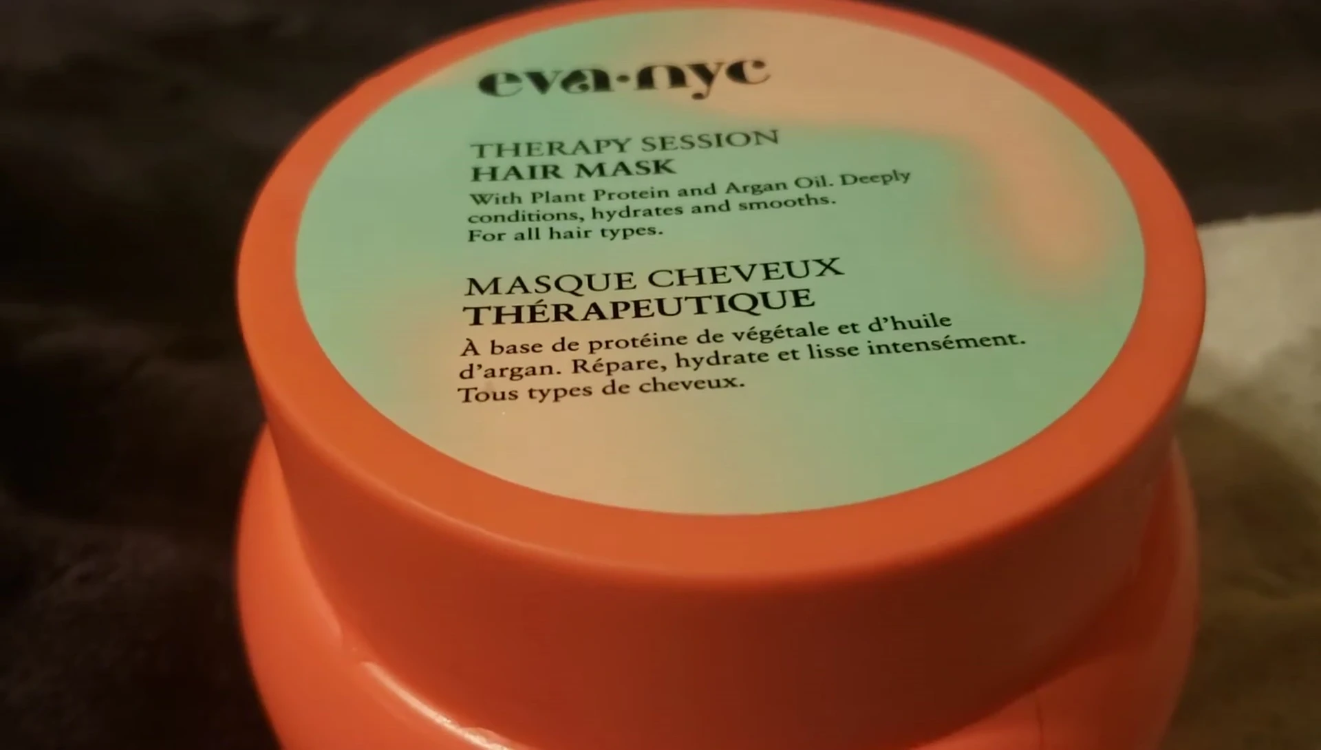 The reviewer showing how she applied the clay from root to ends.