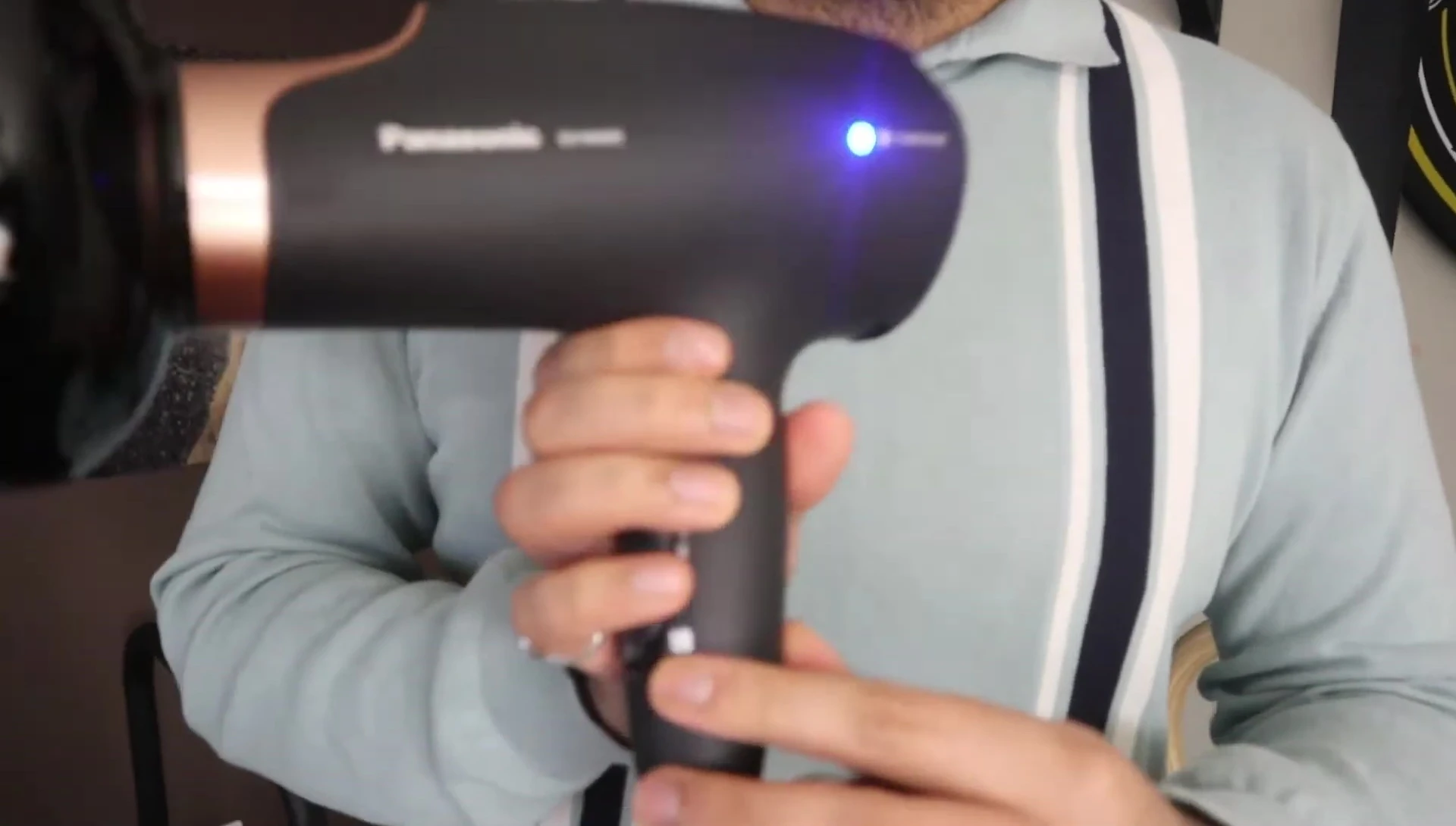 Hair dryer in use, showcasing the heat and speed settings.