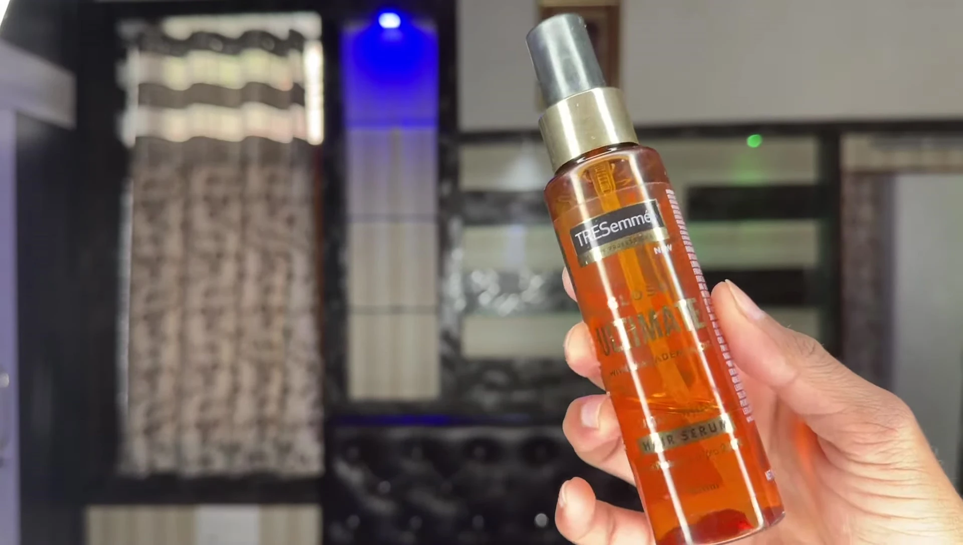 Close-up shot of the Tresemme serum bottle